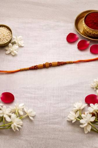 wooden bead designer rakhi with roli chawal and raksha bandhan card