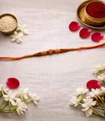 wooden bead designer rakhi with roli chawal and raksha bandhan card