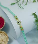 evil eye designer rakhi with roli chawal and raksha bandhan card