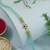 evil eye designer rakhi with roli chawal and raksha bandhan card