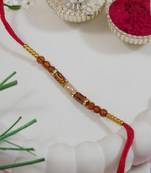 beaded design rakhi with roli chawal and raksha bandhan card