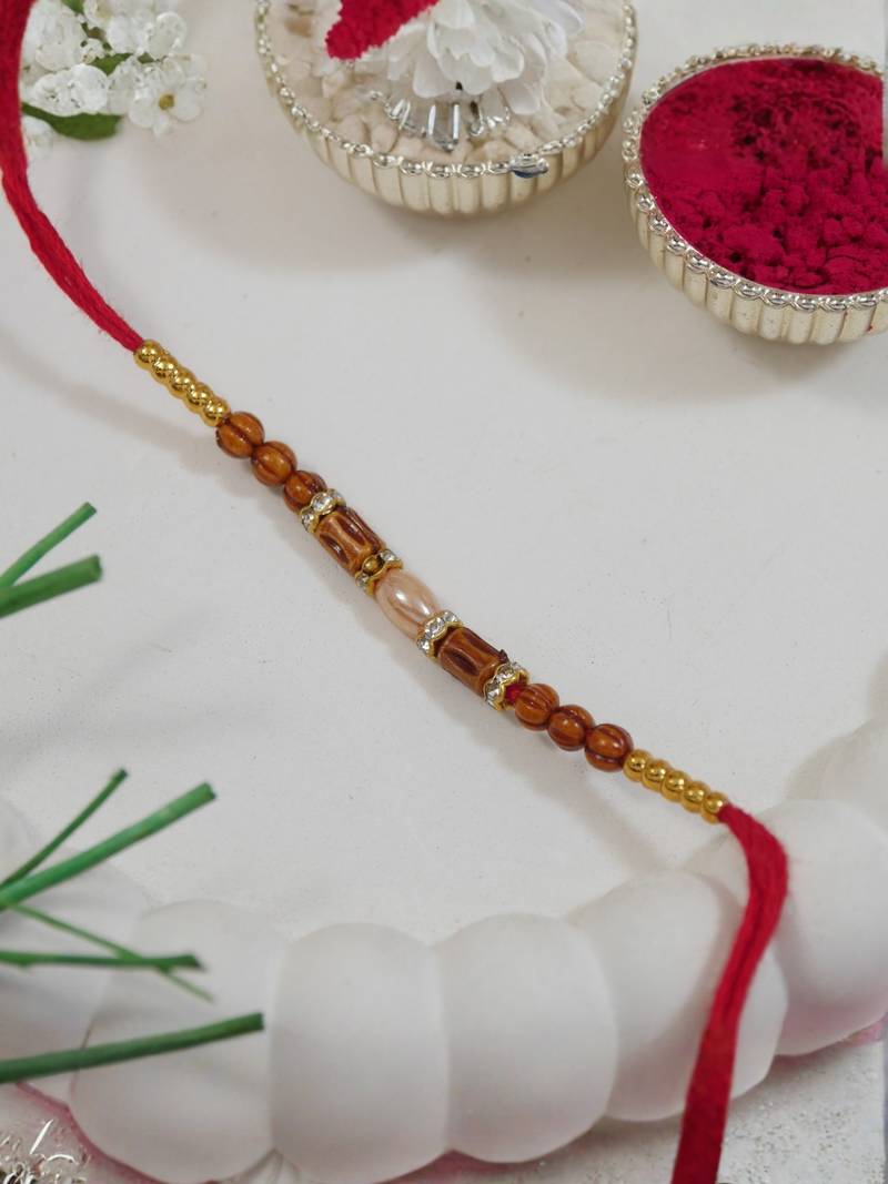 beaded design rakhi with roli chawal and raksha bandhan card