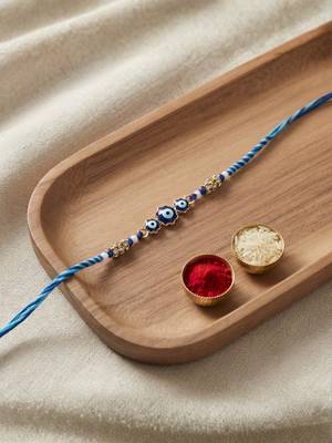 evil eye theme designer rakhi with roli chawal and raksha bandhan card 1