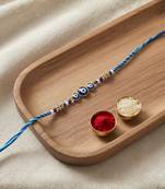 evil eye theme designer rakhi with roli chawal and raksha bandhan card