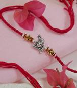 krishna designer red rakhi with roli chawal and raksha bandhan card