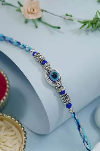 blue stone designer rakhi with roli chawal and raksha bandhan card