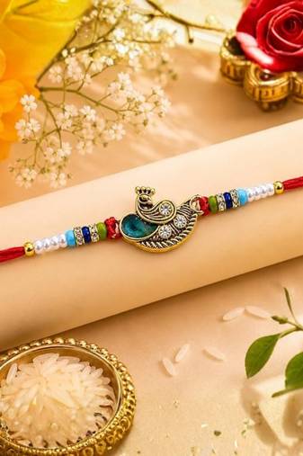 peacock designer red rakhi with roli chawal and raksha bandhan card