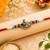 peacock designer red rakhi with roli chawal and raksha bandhan card