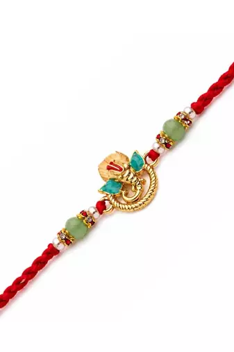 ganesha designer red rakhi with roli chawal and raksha bandhan card