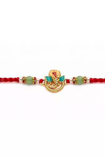 ganesha designer red rakhi with roli chawal and raksha bandhan card