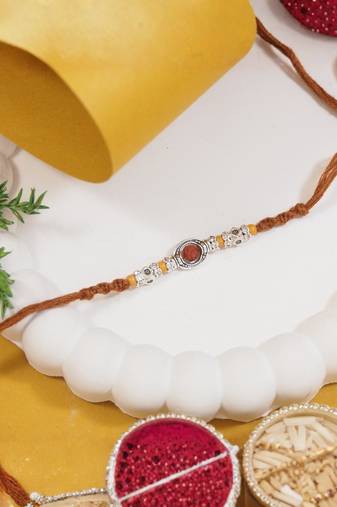 rudraksha designer rakhi with roli chawal and raksha bandhan card