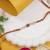 rudraksha designer rakhi with roli chawal and raksha bandhan card