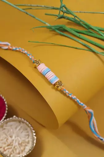 clay kids rakhi with roli chawal and raksha bandhan cards