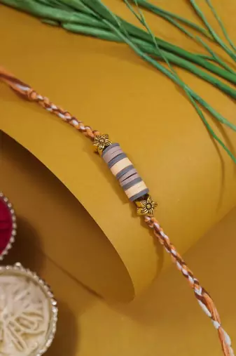 clay kids rakhi with roli chawal and raksha bandhan cards