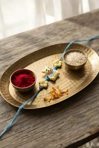 kids rakhi with roli chawal and raksha bandhan cards