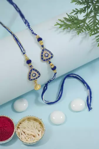 evil eye rakhi with roli chawal and raksha bandhan cards