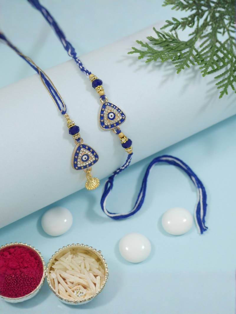 evil eye rakhi with roli chawal and raksha bandhan cards