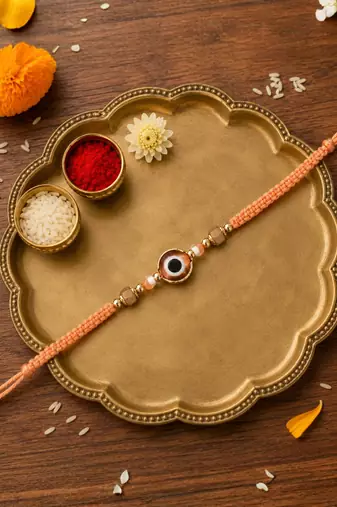 evil eye rakhi with roli chawal and raksha bandhan cards