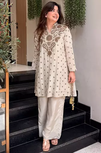 Cream silk crepe heavy thread embroidery work kurta with palazzo