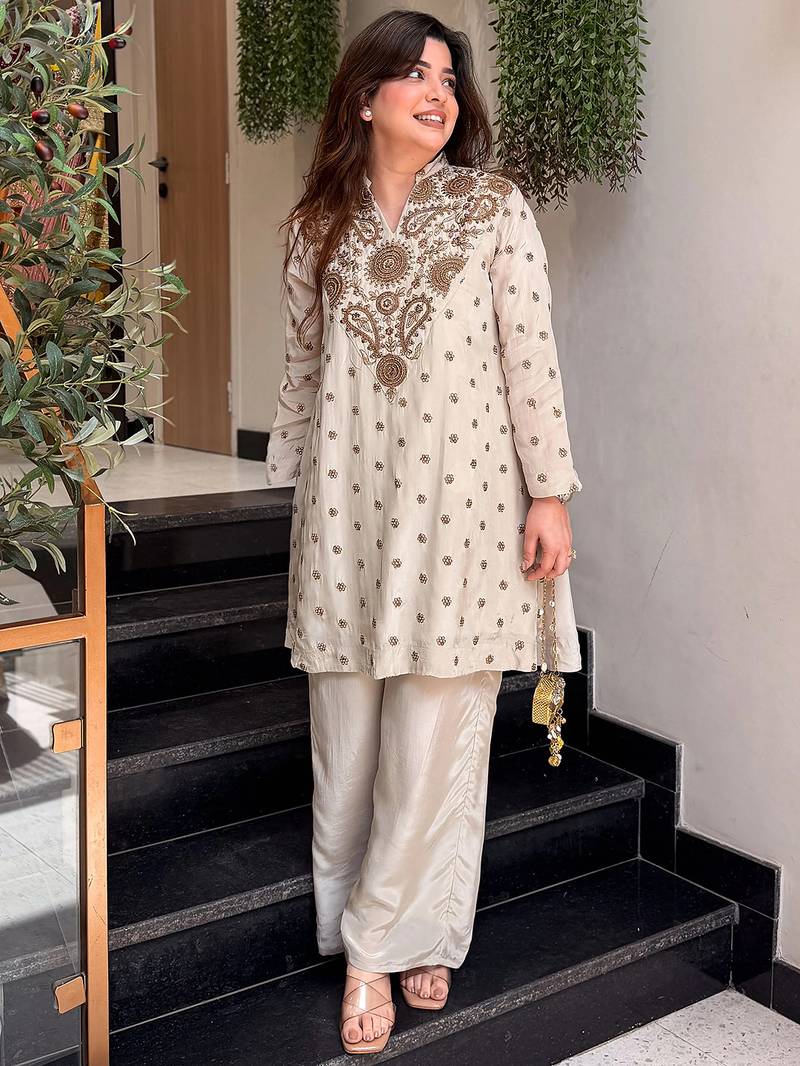 Cream silk crepe heavy thread embroidery work kurta with palazzo