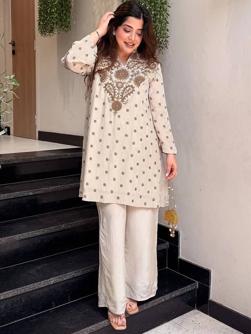 Cream silk crepe heavy thread embroidery work kurta with palazzo