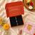 Luxury crystal rakhi with red & green beads for raksha bandhan