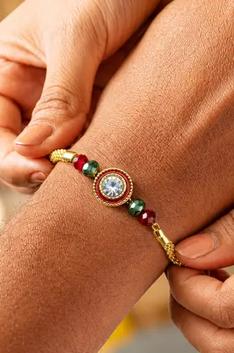 Luxury crystal rakhi with red & green beads for raksha bandhan