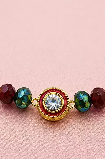 Luxury crystal rakhi with red & green beads for raksha bandhan