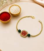 Gold-tone swastik designer rakhi with green beads