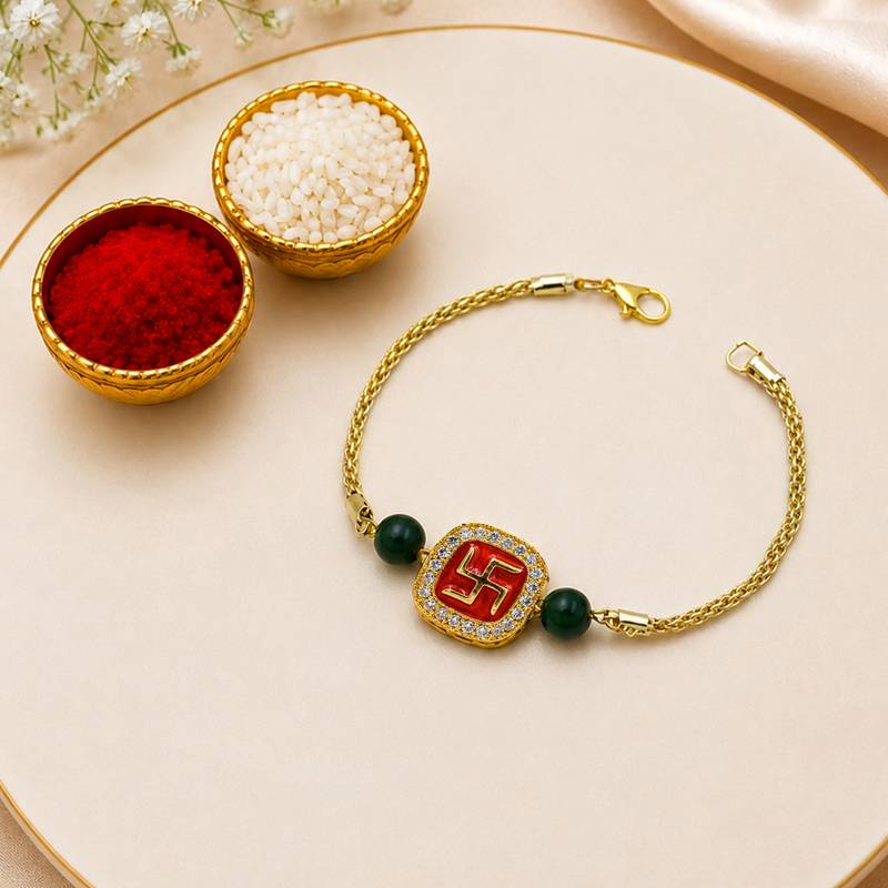 Gold-tone swastik designer rakhi with green beads