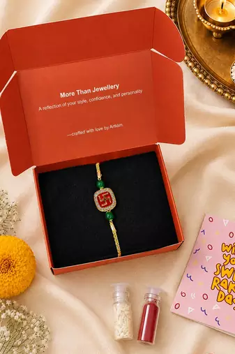 Gold-tone swastik designer rakhi with green beads