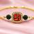 Gold-tone swastik designer rakhi with green beads