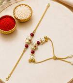 Gold-plated lotus bhaiya bhabhi rakhi set with red beads
