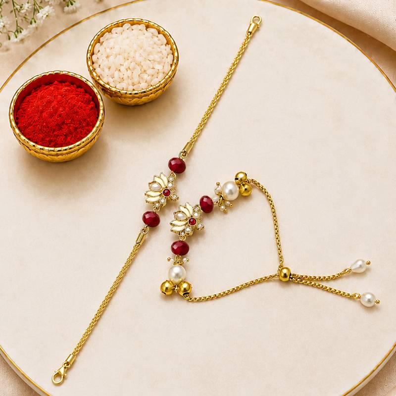 Gold-plated lotus bhaiya bhabhi rakhi set with red beads