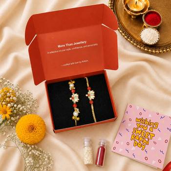 Gold-plated lotus bhaiya bhabhi rakhi set with red beads 2