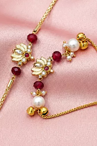 Gold-plated lotus bhaiya bhabhi rakhi set with red beads