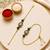 Lotus designer bhaiya bhabhi rakhi set with green beads