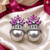 Rhodium finish ruby and pearl ad earrings