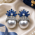 Rhodium finish sapphire and pearl ad earrings