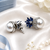 Rhodium finish sapphire and pearl ad earrings