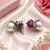 Rhodium finish ruby and pearl ad earrings