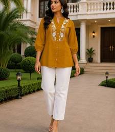 Yellow embroidered short tunic kurti with off-white bottom set