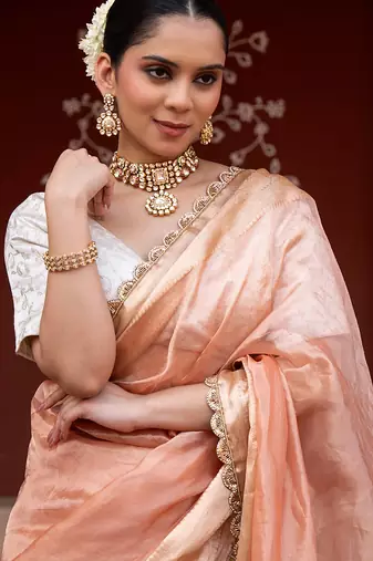 Peach embroidered pure tissue silk saree