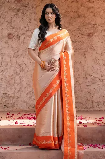 Orange embroidered pure tissue silk saree