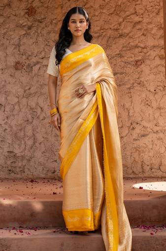 Yellow embroidered pure tissue silk saree
