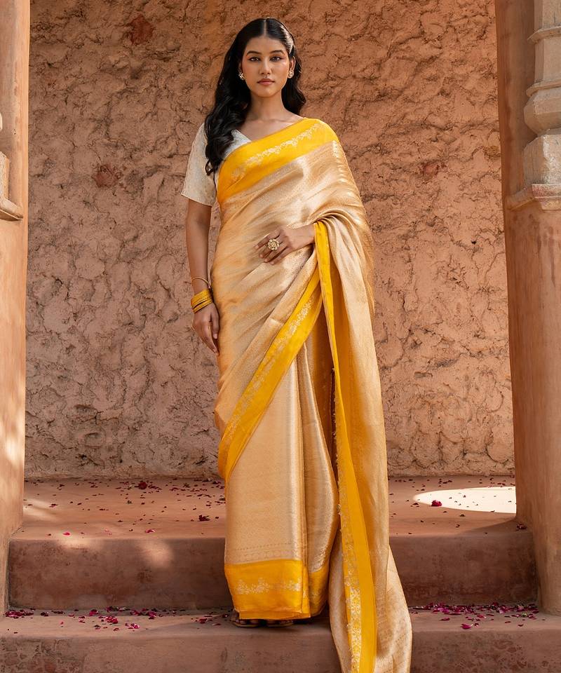 Yellow embroidered pure tissue silk saree
