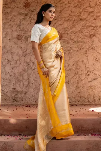 Yellow embroidered pure tissue silk saree
