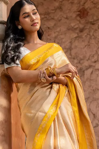 Yellow embroidered pure tissue silk saree