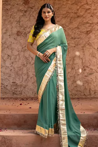 Sage green embroidered pure georgette saree
