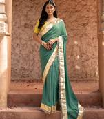 Sage green embroidered pure georgette saree